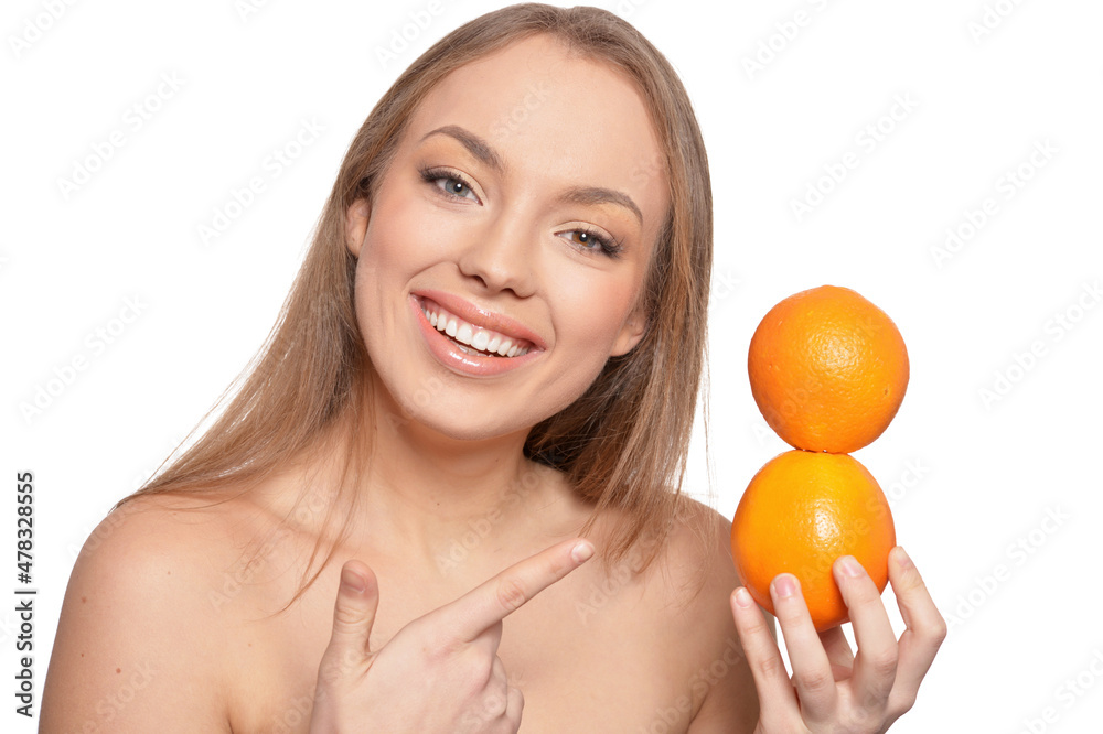 Portrait of young woman posing with oranges Portrait of young woman posing with oranges