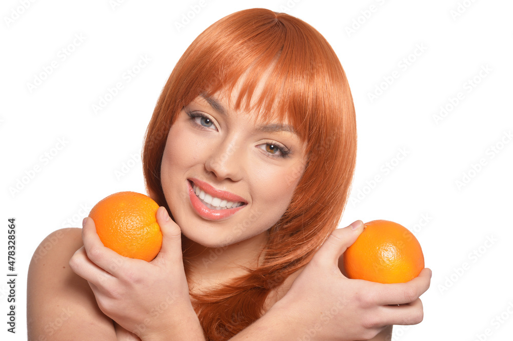 Portrait of young woman posing with oranges Portrait of young woman posing with oranges