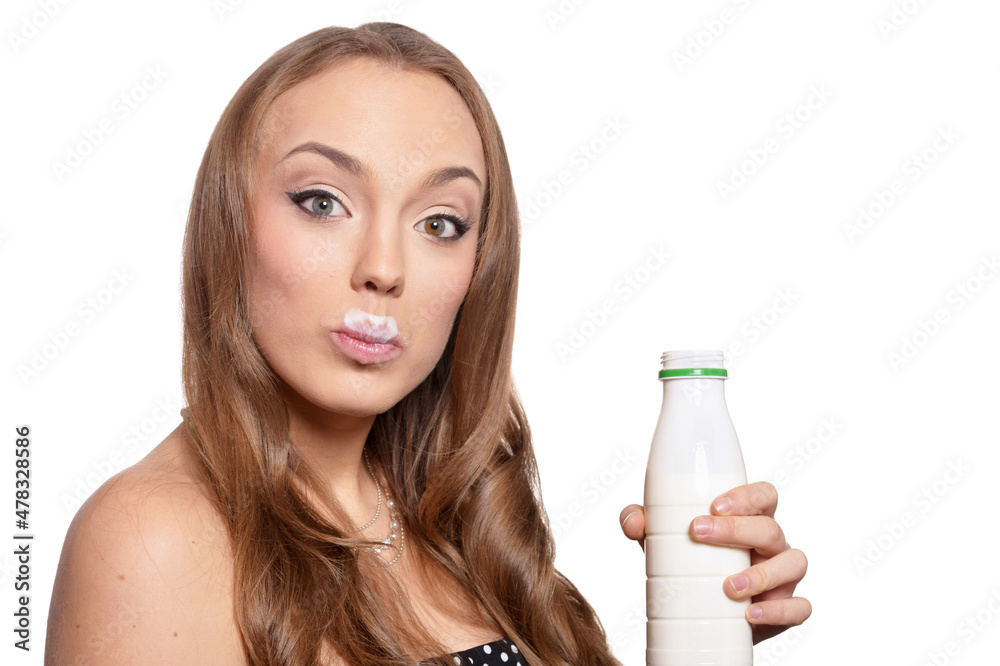 Portrait of a beautiful young woman with milk