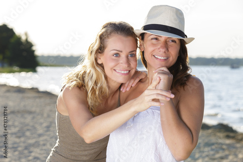 close up of women enjoying on beach