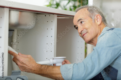 close-up of a senior holding a sink