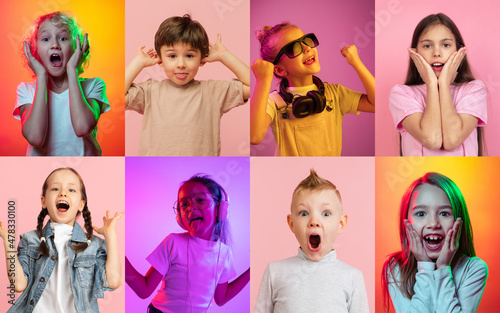 Collage of portraits of little cute kids, boys and girls isolated on multicolored studio background in neon light. Emotions, facial expression, childhood concept