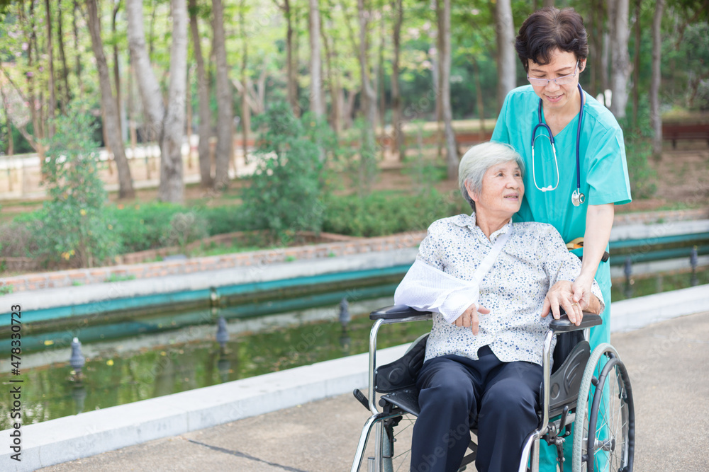 Asian healthcare worker drive a wheelchair of old patient, happy hospital, rehabilitation activity, elderly health care Asian healthcare worker drive a wheelchair of old patient, happy hospital, rehabilitation activity, elderly health care