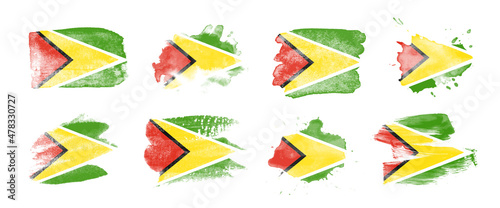 Painted flag of Guyana in various brushstroke styles.