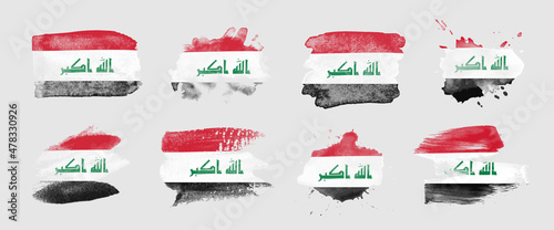 Painted flag of Iraq in various brushstroke styles.