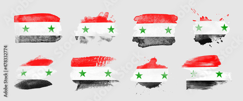 Painted flag of Syria in various brushstroke styles.