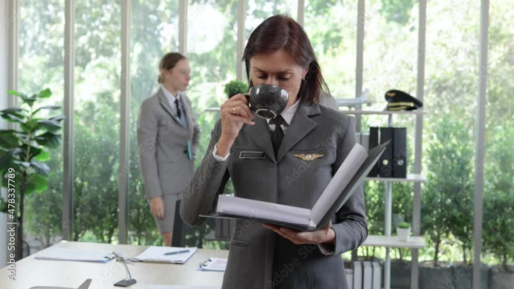 female aviation business manager reviewing the document report in office