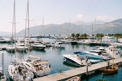 Motorboats and sailboats moored at the pier. Porto, Montenegro © Nadtochiy