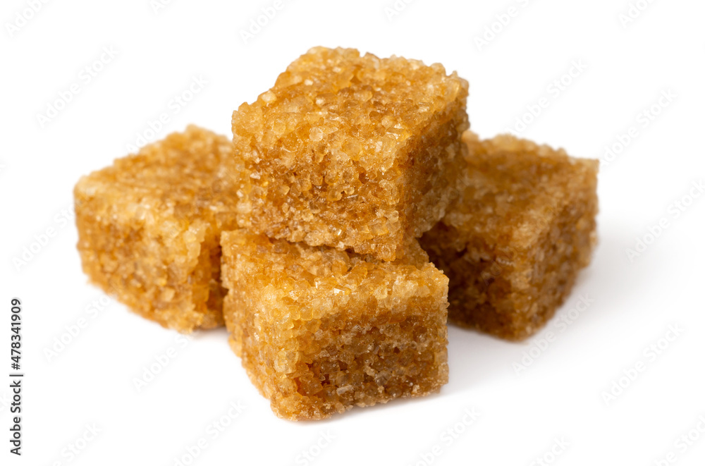 Brown sugar cubes isolated on white background Brown sugar cubes isolated on white background