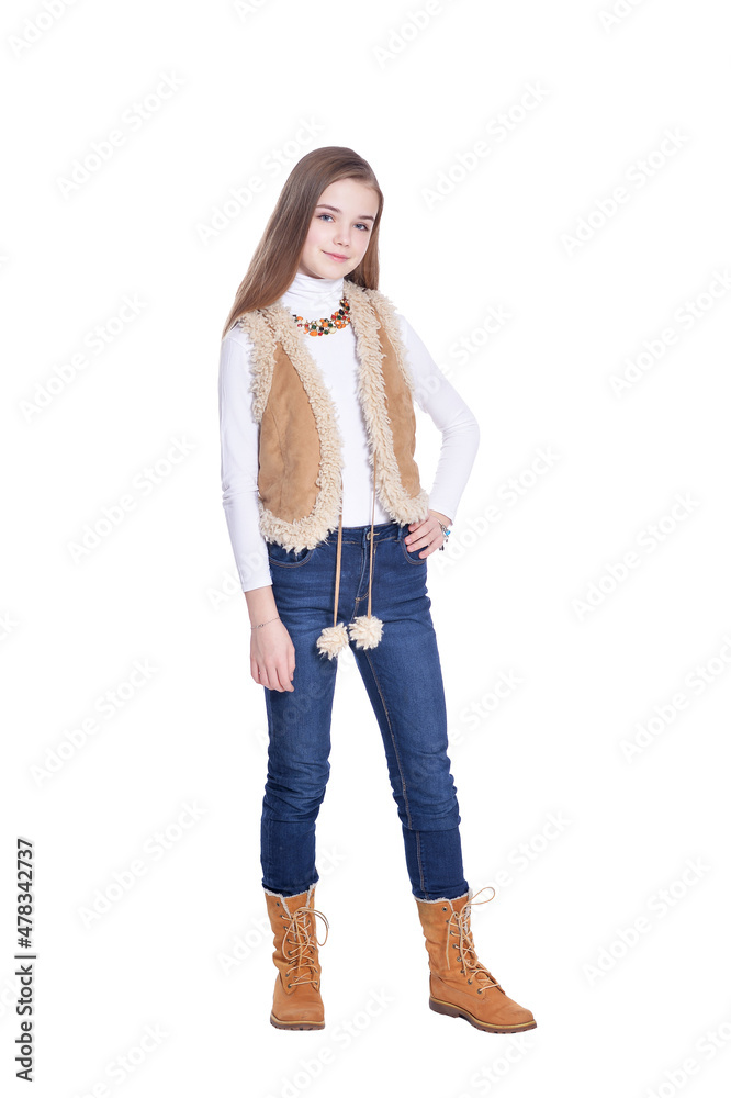 Happy little girl in jeans posing on white background Happy little girl in jeans posing on white background
