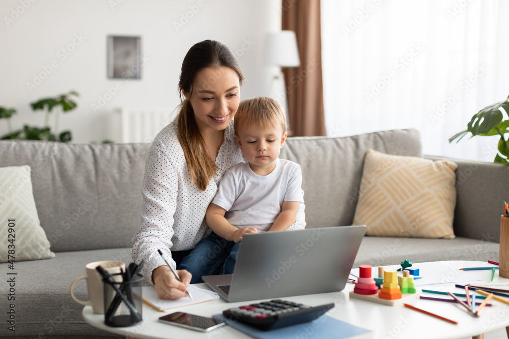 online-education-young-mother-holding-baby-and-studying-with-laptop