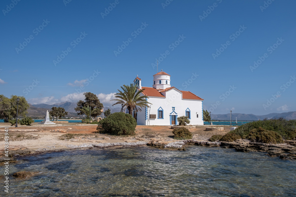 Elafonisos Peloponnese. Greece. Agios Spyridon church at island port, sunny day, blue sky