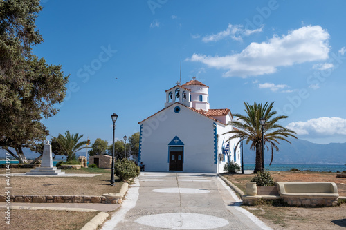 Elafonisos Peloponnese. Greece. Agios Spyridon church at island port, sunny day, blue sky © Rawf8