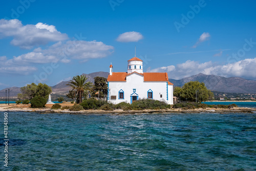 Elafonisos Peloponnese. Greece. Agios Spyridon church at island port, sunny day, blue sky photo