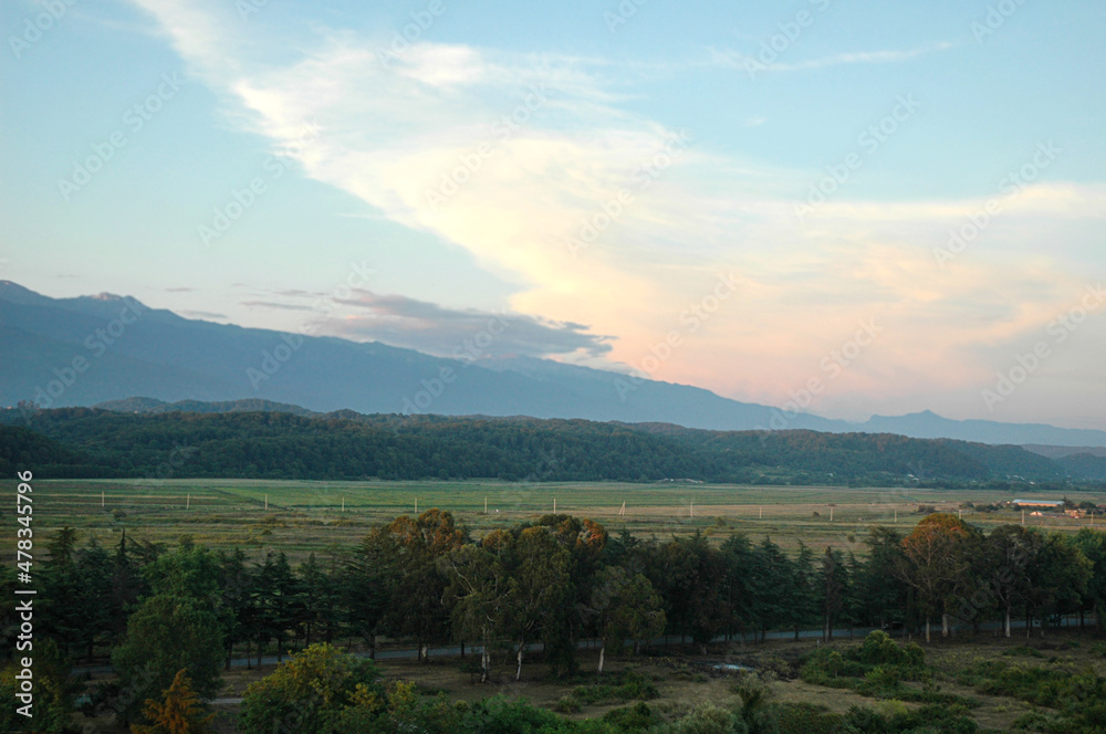 Bird's-eye view of the mountains. Sunset over Pitsunda. Natural landscape at sunset.
