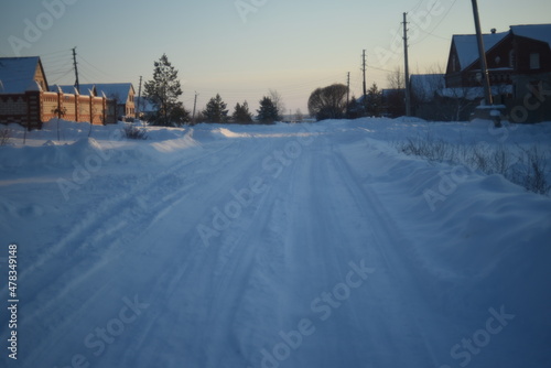 Snowy road in winter during the day © Lushchikov Valeriy