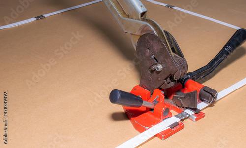 manual strapping of packages for shipping