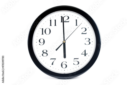 Black classic clock on isolated white background.