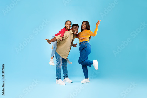 African American girl spending time with her mom and dad