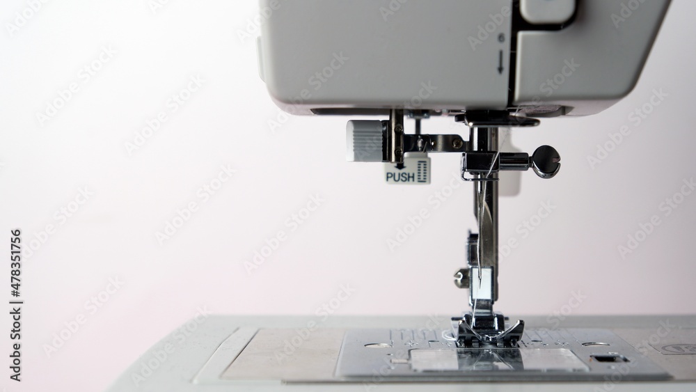 Close up of gray sewing machine