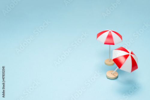 Red umbrella on a blue background.