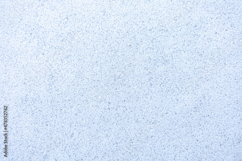 Natural pure white crystal fuzzy frozen ice covering the floor surface at cold weather after blizzard snow in winter season, top view. Abstract beauty texture background, cool nature concept.