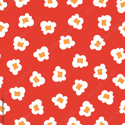 seamless pattern with popcorn on red background