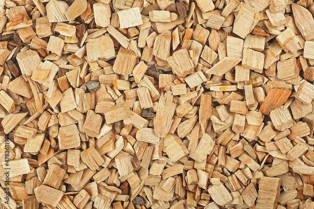 Wood smoking chips as background. Dry wood shavings background. Ecological fuel. Wood smoking chips as background. Dry wood shavings background. Ecological fuel.
