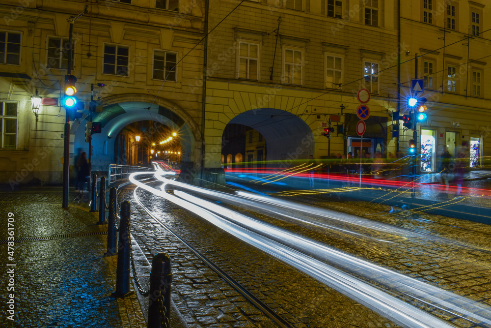 Blurred traffic, night streets and tunnels through buildings Blurred traffic, night streets and tunnels through buildings