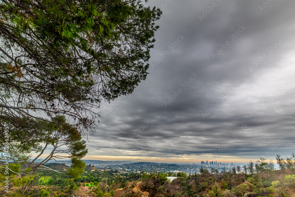 Dark sky over Bronson Canyon with Los Angeles on the background