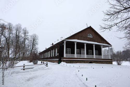 beautiful winter view to Trigorskoye estate wooden main building old house in the snow, Pushkin hills, Russia