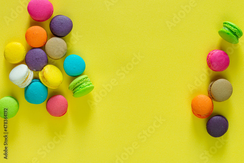 Colorful macaroon on yellow background 