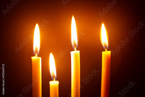 Many candles on a black background