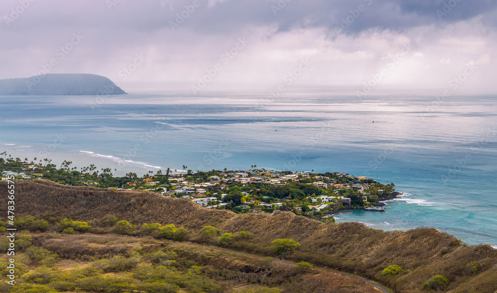 Aerial view of Honolulu, ocean, and foggy mountains from the summit of Diamond Head crater in Oahu, Hawaii