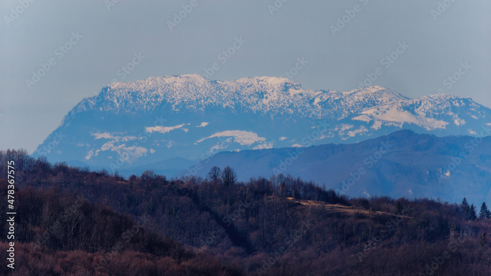 Serene view of wooded Samobor hills with Alpes and blue sky in the background, Samobor, Croatia