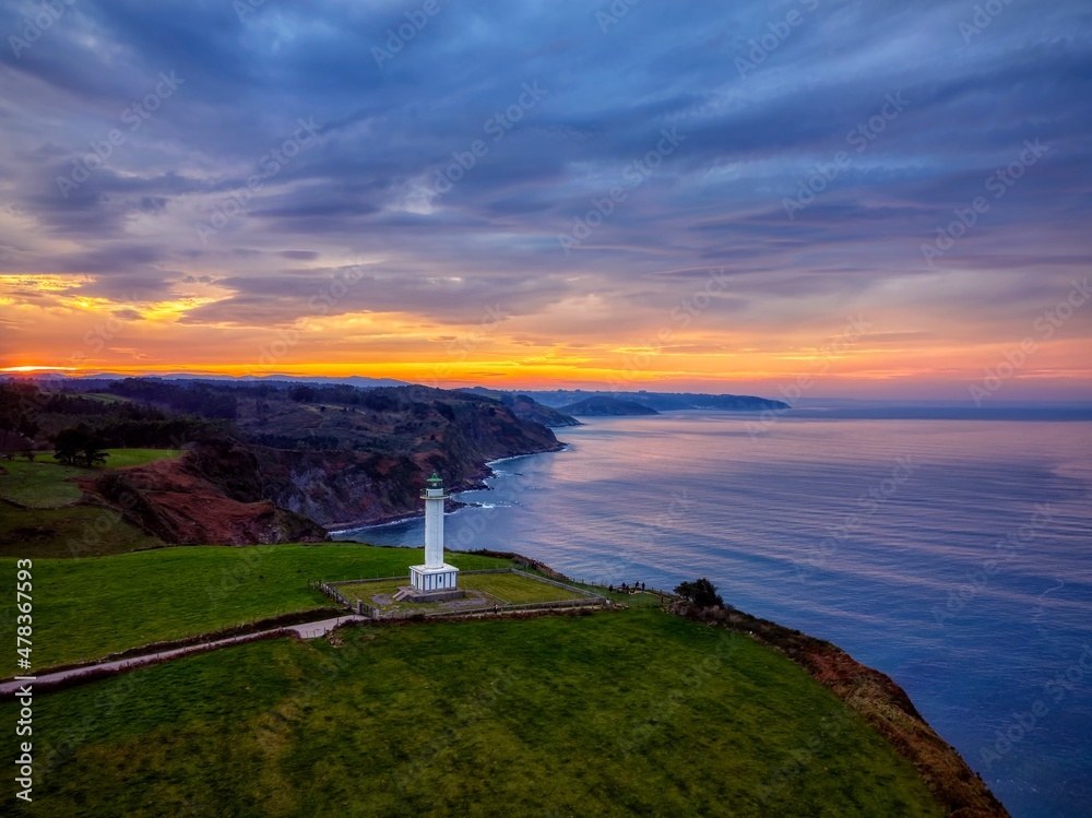 The lighthouse of Lastres  at sunset located in the town of Luces, Asturias, Spain.