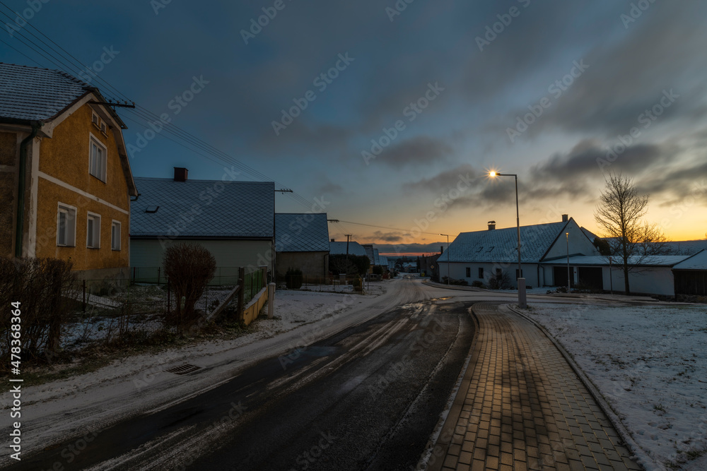 Sunrise near Ctibor and Halze villages in cold snowy morning with chapel