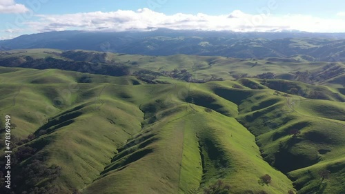 Green grass covers the rolling hills and valleys of the Tri-valley area of Northern California, just east of San Francisco Bay. This beautiful region is known for its many vineyards and open space. photo