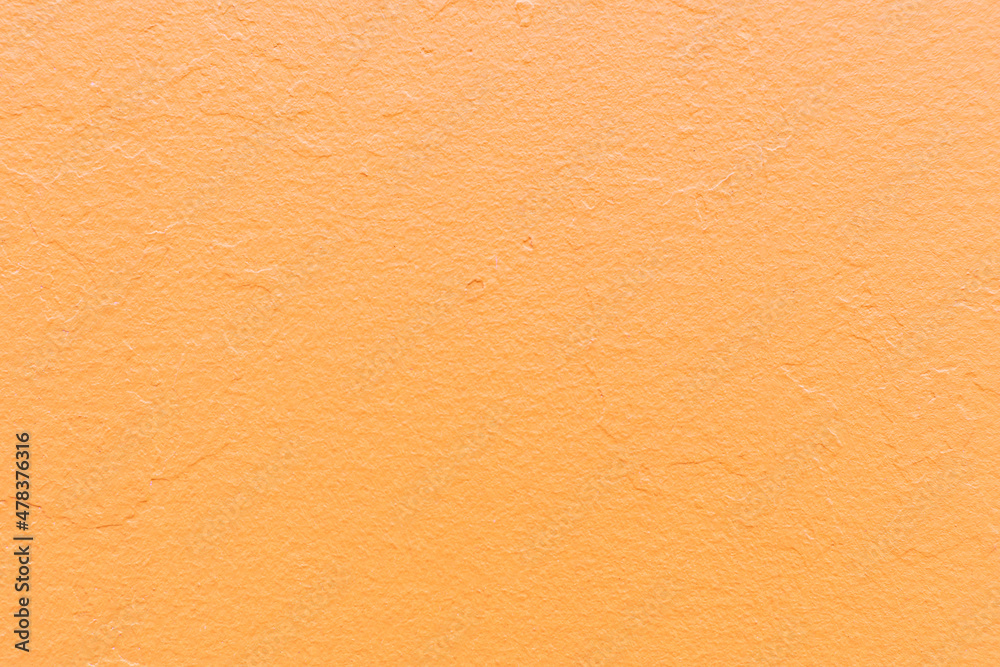 Abstract bright orange painted wall textured background, yellow backdrop Abstract bright orange painted wall textured background, yellow backdrop