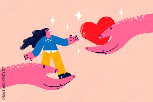 Woman and heart in hands showing support  photo