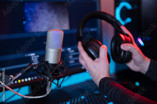 Professional microphone on the streaming or podcast room background