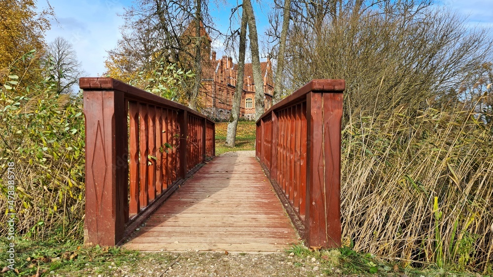 Beautiful old Latvian castle Jaunmoku among trees with yellowed leaves October 16, 2021 Beautiful old Latvian castle Jaunmoku among trees with yellowed leaves October 16, 2021