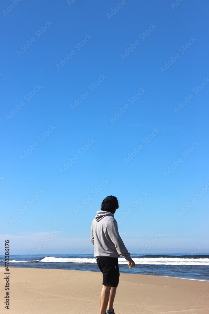 Man looking at the ocean