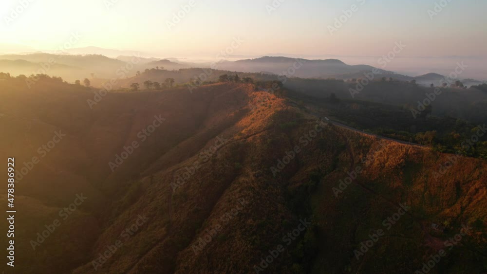 4K aerial view over a misty mountainous area. The great golden sun in the morning
4K aerial view over a misty mountainous area. The great golden sun in the morning