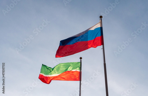Flag of Russia and flag of the Republic of Tatarstan against the sky. Waving flags