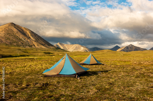 Light weight tarp tents pitched on an alpine plateau high in the Northern Talkeetna Mountains of Alaska.