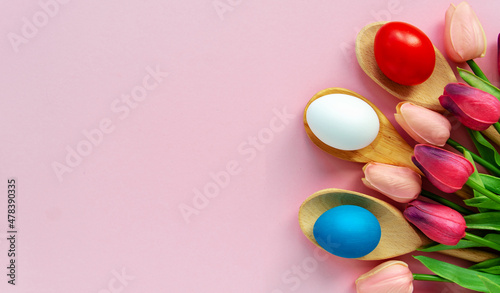 Easter background with blue  red and white Easter eggs . Top view with copy space.