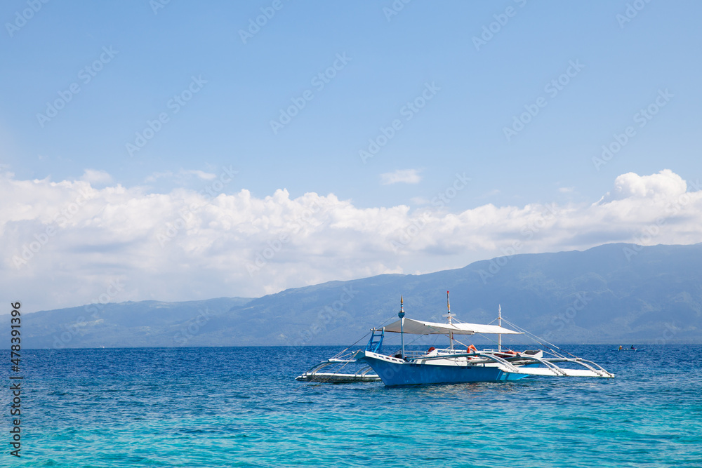 beautiful turquoise ocean water with boat. boat at sea. Beautiful seascape.