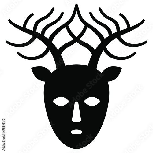 Head of Celtic god Cernunnos. Pagan mask. Horned human male face with deer antlers. Lord of beasts and wild nature. Black and white silhouette.