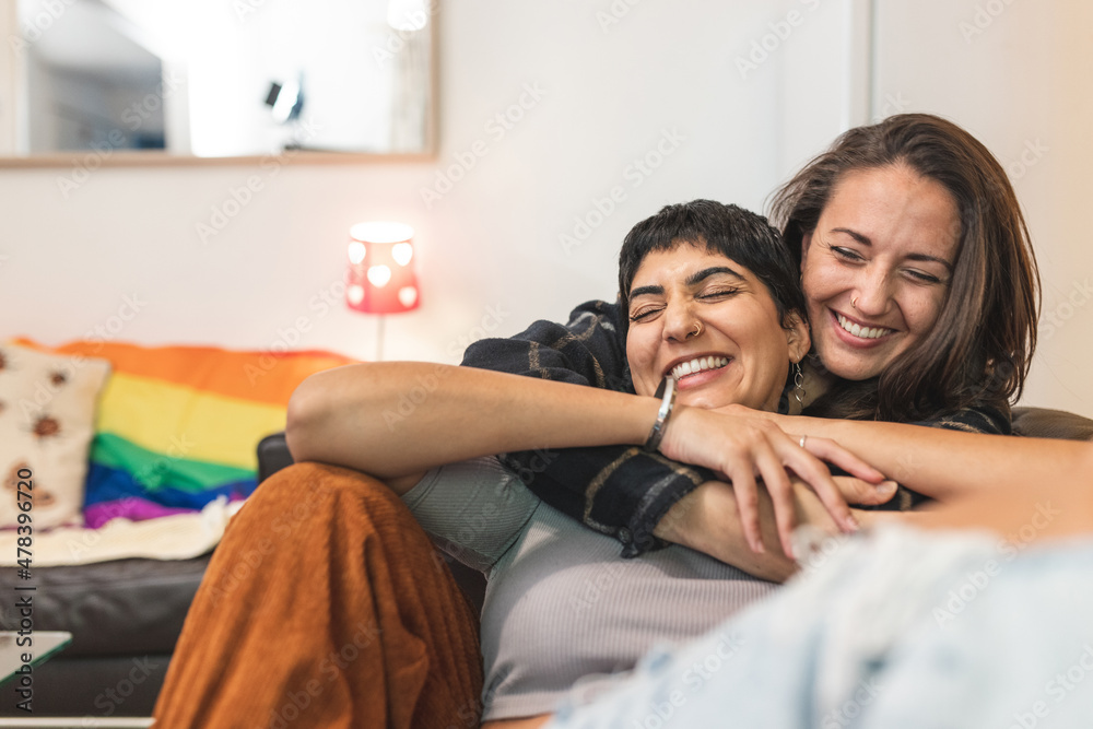 Lesbian couple at home enjoying life together Lesbian couple at home enjoying life together